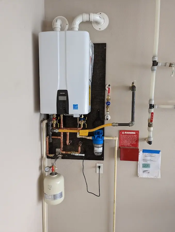 Professional plumber installing copper piping in a Port Neches home